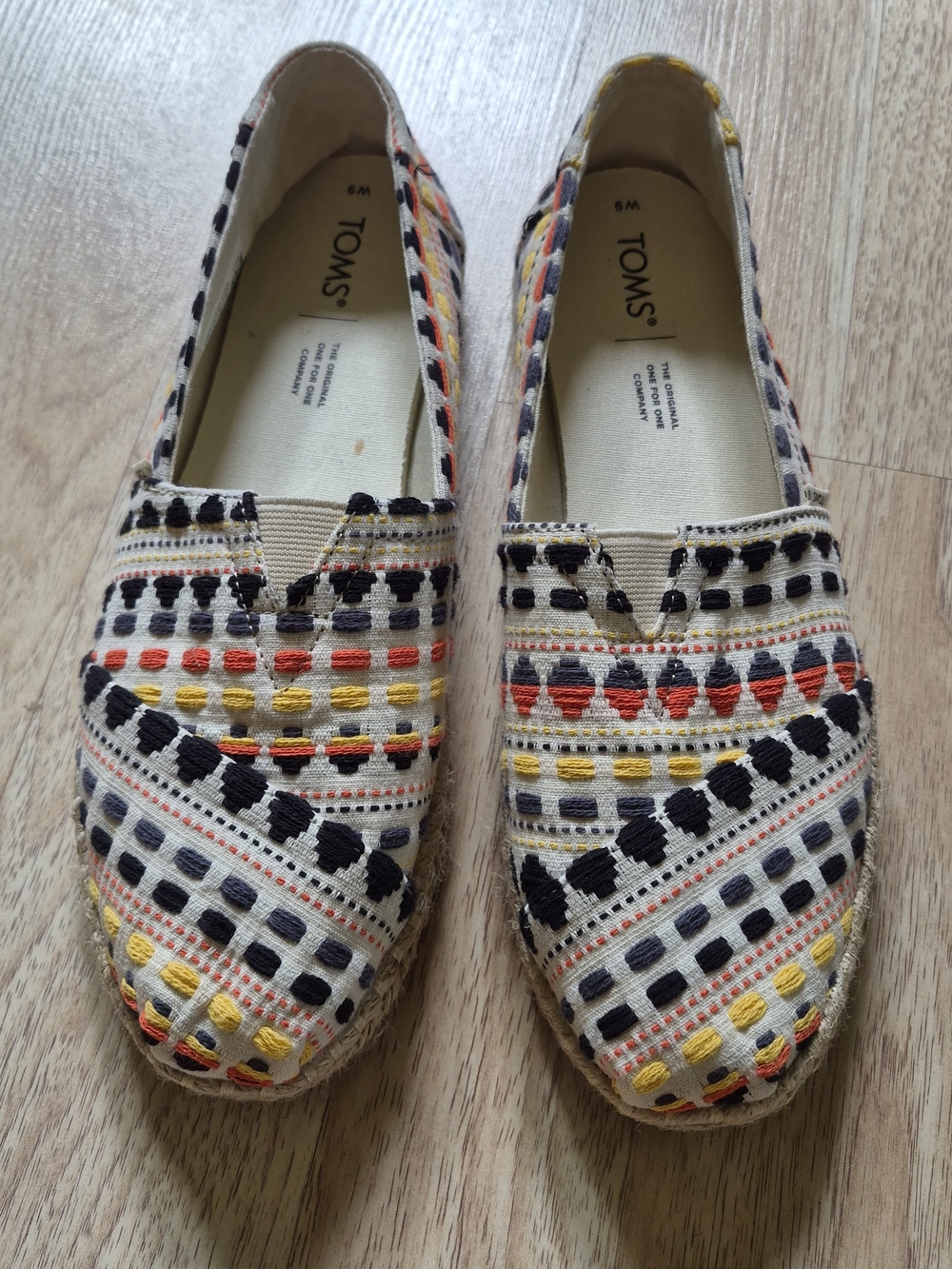 TOMS Cream Espadrilles with Black, Yellow & Red Embroidery